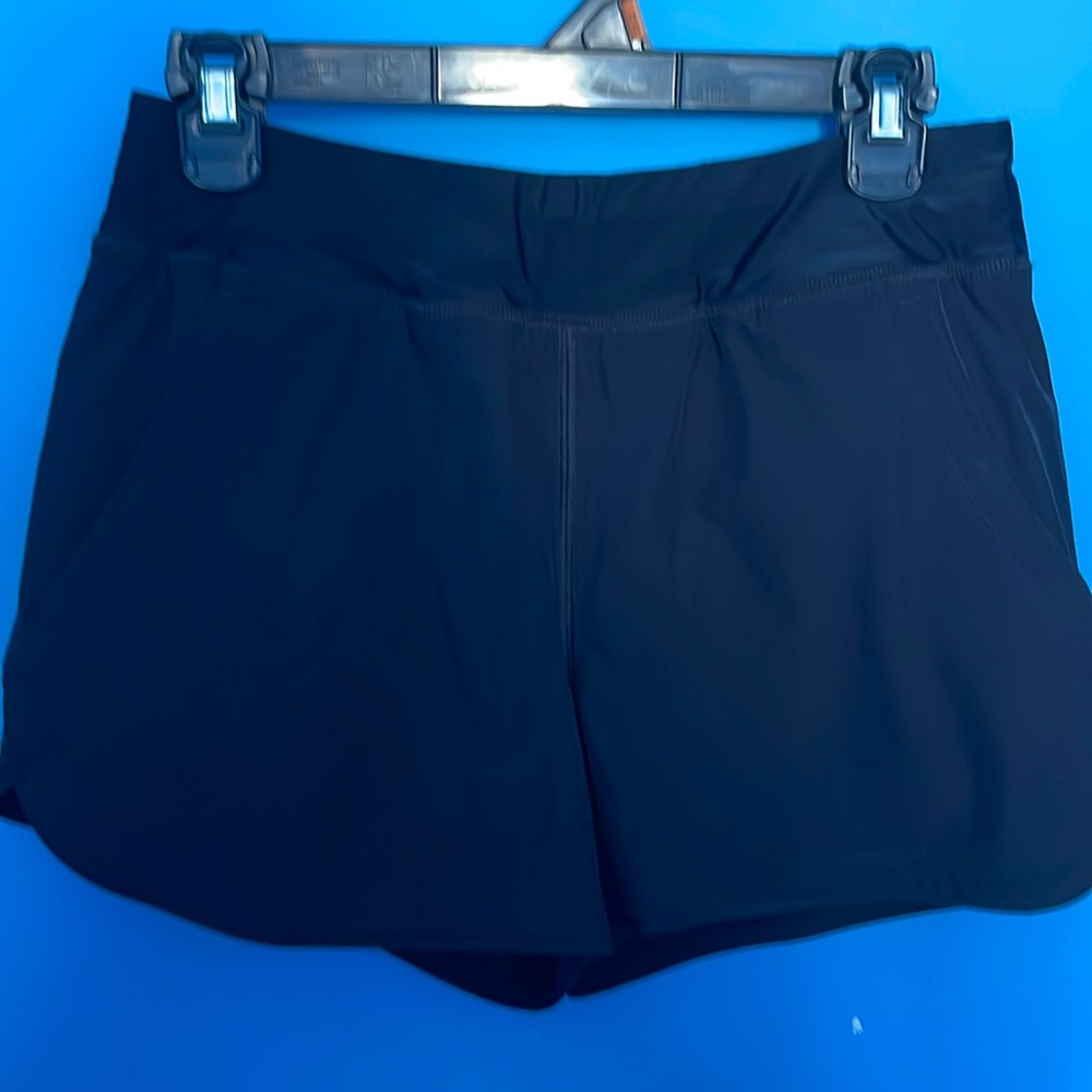 Lands’ End swimming shorts with liner and pockets. New without tags. Size 6